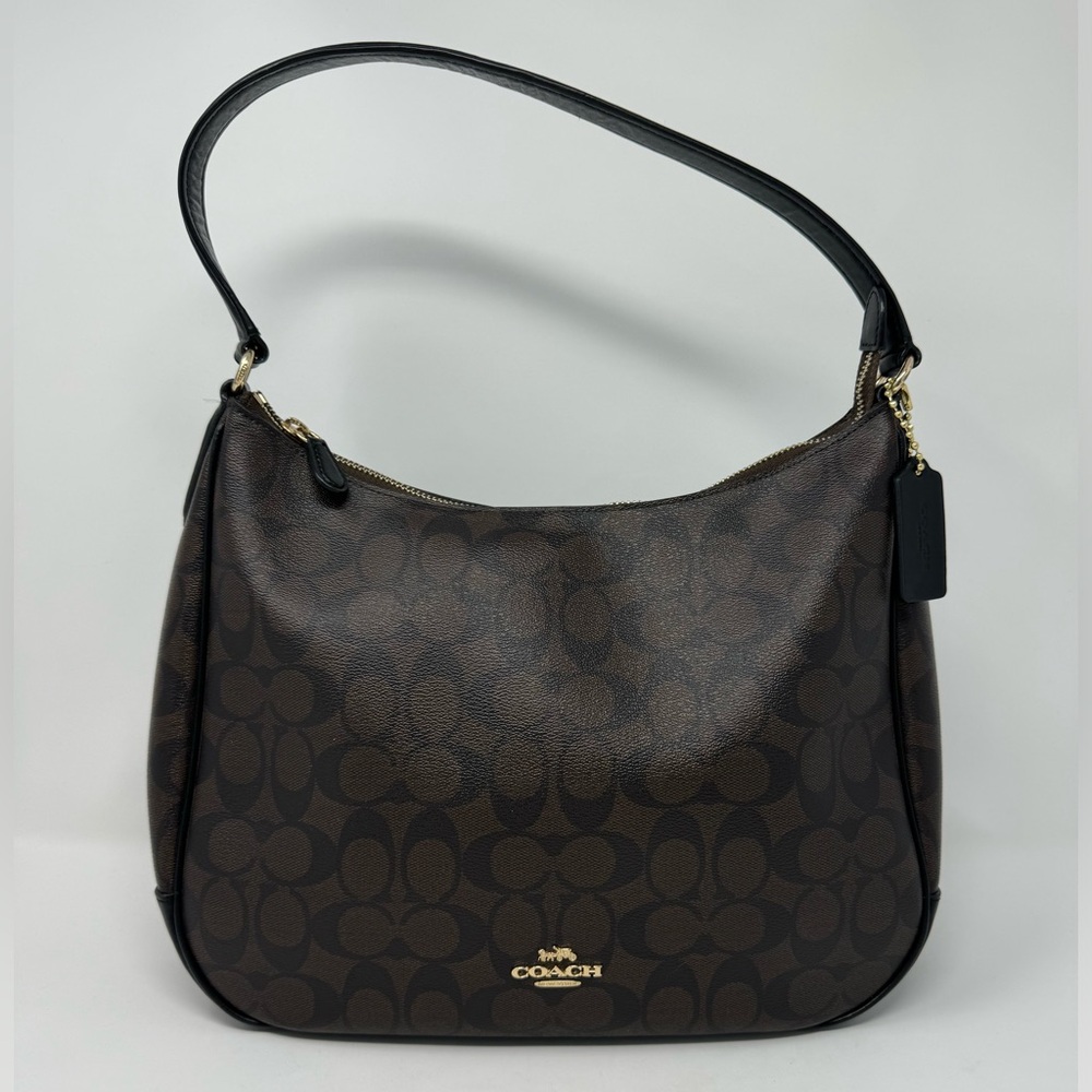 Coach Brown and Black Leather Signature
Logo Hobo $320